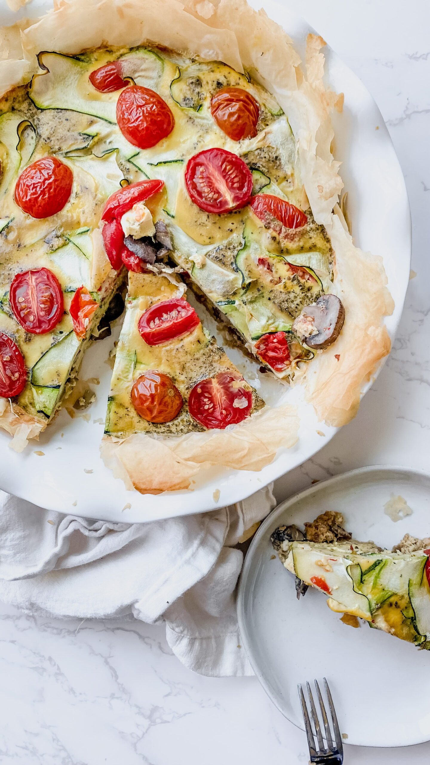 Garden tomato quiche in glass pan with cottage cheese