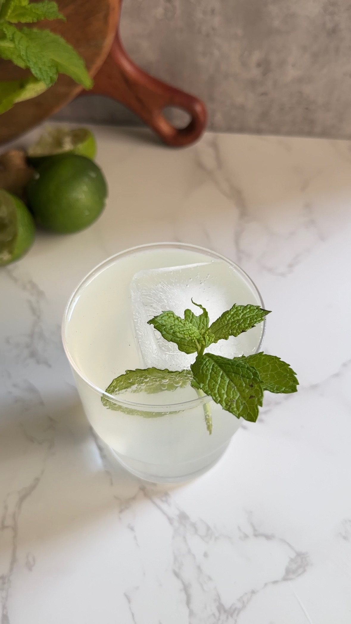 Mocktail mule with mint leaves and ice in a clear glass