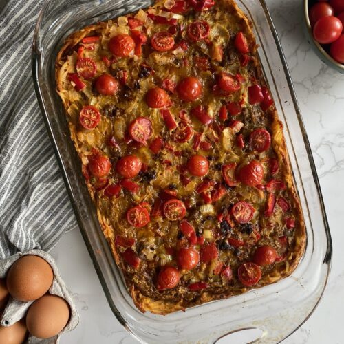 Potato crusted breakfast casserole in a glass baking dish